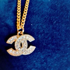 Gorgeous reworked Chanel charm necklace.